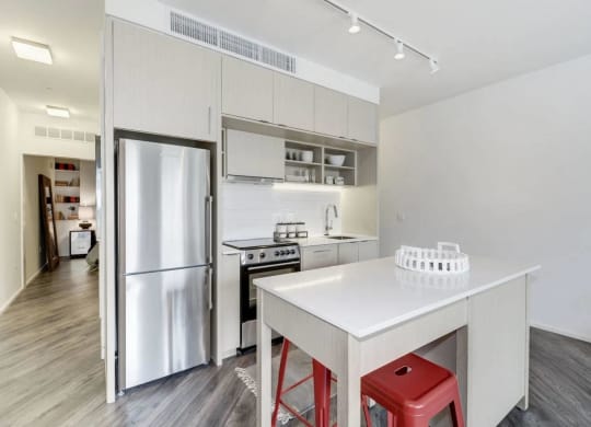 a kitchen with a white counter and a refrigerator at Reed Row, Washington DC