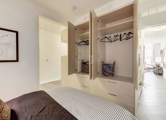 a bedroom with a bed and a closet at Reed Row, Washington DC