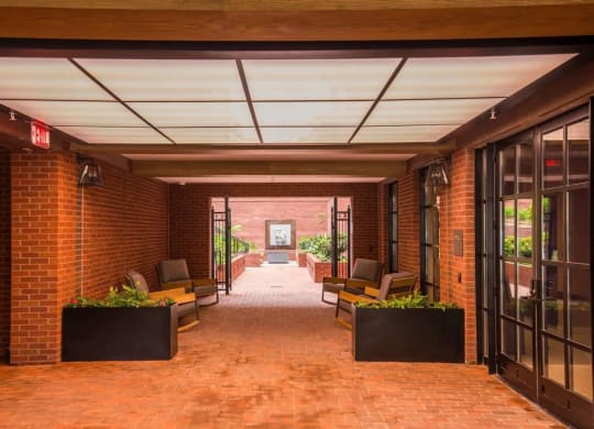 the lobby of a building with brick walls and glass doorsat Reed Row, Washington, DC