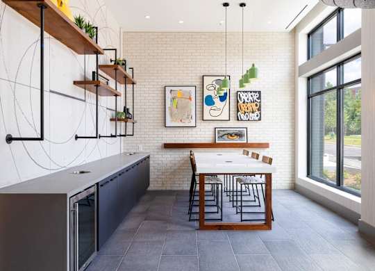 a kitchen with a long table and a large window at The Chase at Bryant Street, Washington