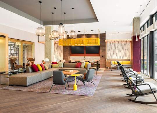 the lobby of a hotel with couches and chairs and tables at The Chase at Bryant Street, Washington, DC