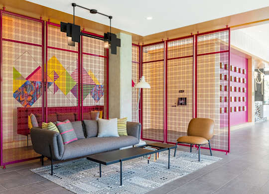a living room with a couch and a coffee table in a lobby at The Chase at Bryant Street, District of Columbia, 20002