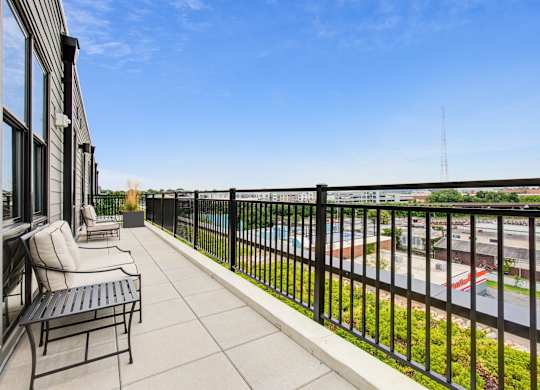 a balcony with a seating area and a view of a parking lot at Coda at Bryant Street, Washington, DC 20002