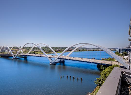 A bridge spans across a body of water.