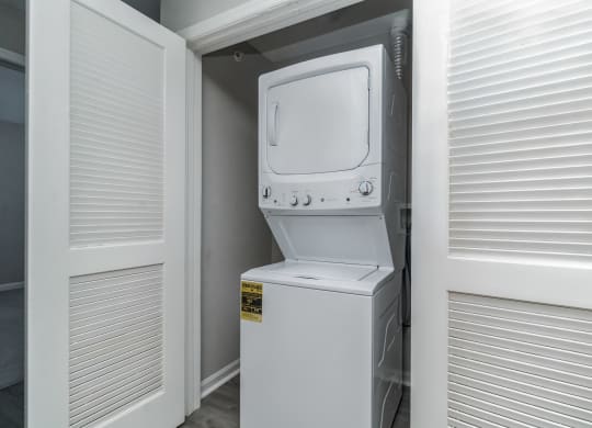 the laundry room has a washer and dryer in it at The Fields at Lorton Station, Lorton, VA