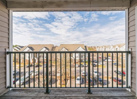 a balcony with a view of a parking lot at The Fields at Lorton Station, Virginia
