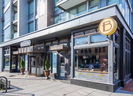 A storefront with a Bitcoin symbol on the sign.