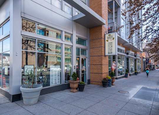 A street view of a building with a sign that says