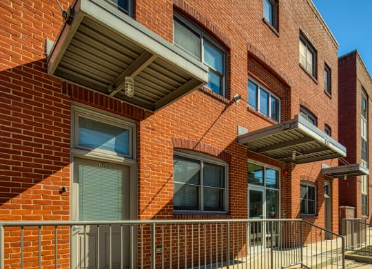 a brick building with a gate in front of it at North Market South Carroll, Frederick