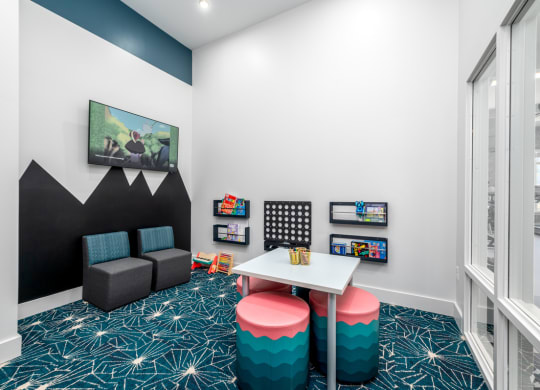 a study room with a table and chairs and a window at Fairmont at South Lake, Maryland, 20716
