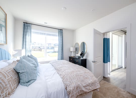 a bedroom with a large bed and a window at Fairmont at South Lake, Maryland, 20716