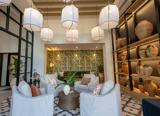 a living room with couches and chairs and a wall filled with vases  at La Unión, Tampa, 33605