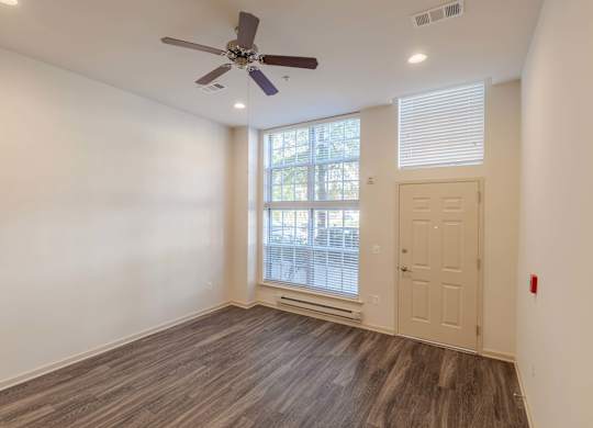 A room with a ceiling fan and wooden flooring at Garfield Park, Arlington, 22201