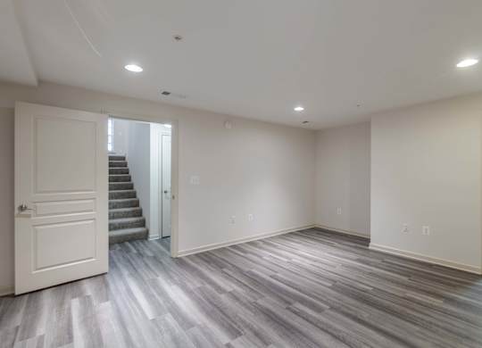 A room with a wooden floor and white walls at Garfield Park, Arlington, 22201