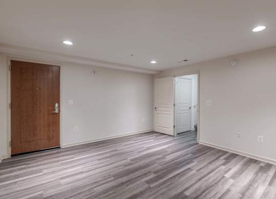 A room with a wooden floor and a white door at Garfield Park, Arlington, 22201