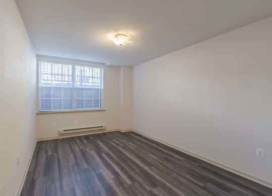 A room with a window and a radiator on the floor at Garfield Park, Arlington, 22201