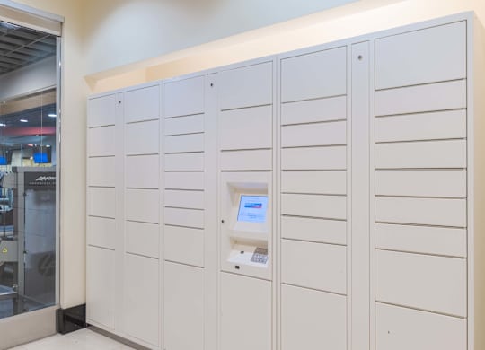 A row of white lockers with a keypad on the right side at Garfield Park, Arlington, 22201