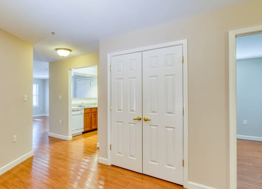 a empty room with a white door and a bathroom at North Market South Carroll, Frederick