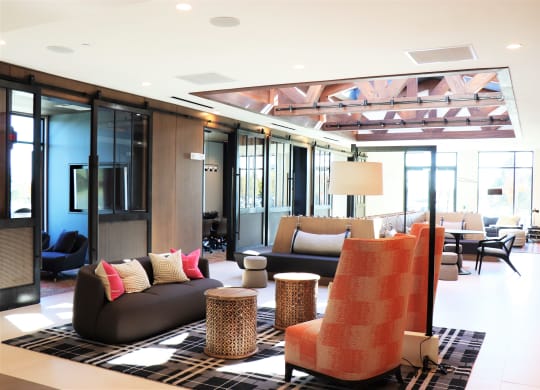 a living room filled with furniture and a large window at Vyne One Loudoun, Virginia