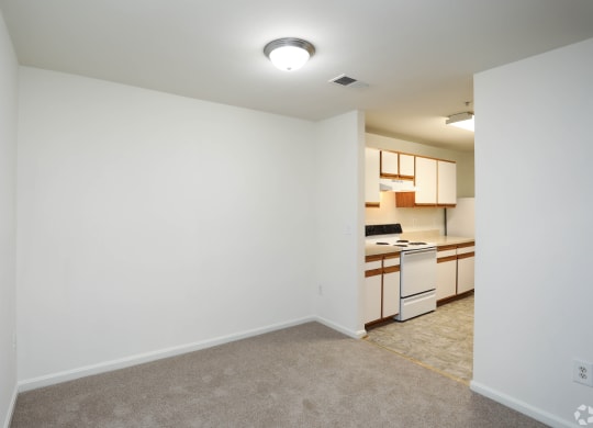 Living Room With Kitchen View at The Fields of Manassas, Manassas