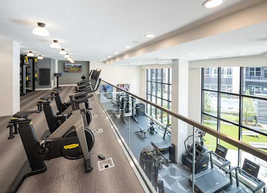 A gym with treadmills and exercise bikes at The Sully Apartments, Virginia, 20151
