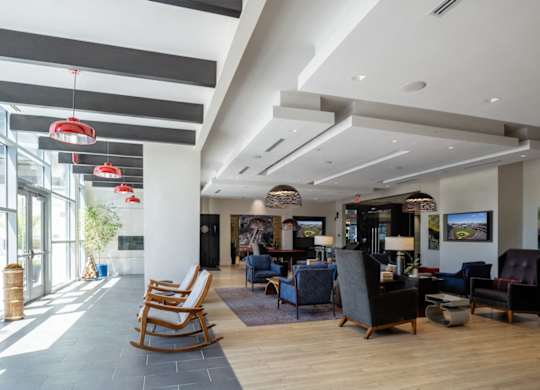 A spacious waiting area with wooden floors and multiple seating options. at Dock 79, Washington, DC 20003 