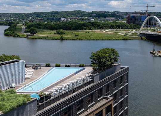 Beautiful bridge over a river with a building in the foreground. at Dock 79, Washington, DC 20003 
