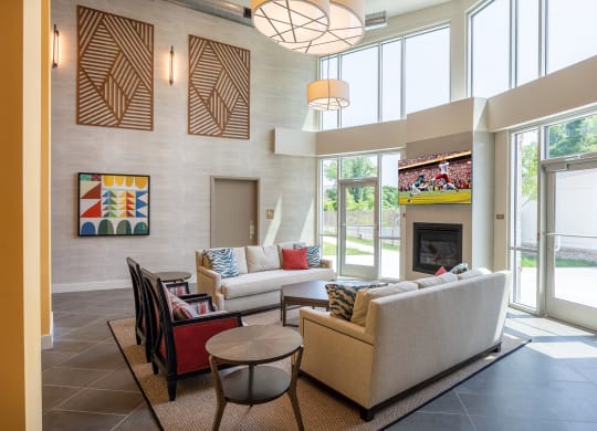 a living room filled with furniture and a large window  at Woodmore Grand, Bowie, 20721