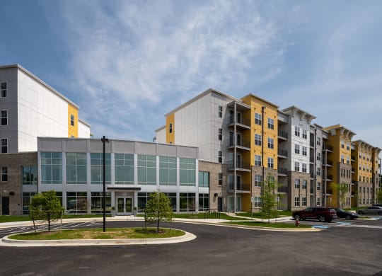 an exterior view of a large building with a parking lot in front of it  at Woodmore Grand, Bowie, 20721