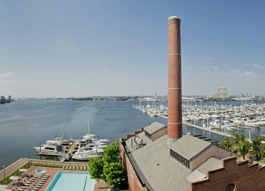 a view of the harbor from a building with a pool and boats in the water at Tindeco Wharf, Maryland