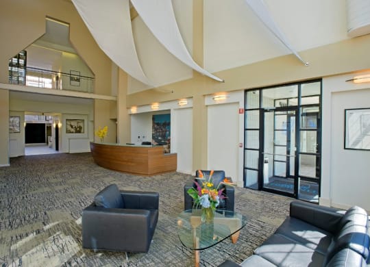 the lobby of a building with couches and a table at Tindeco Wharf, Baltimore, 21224