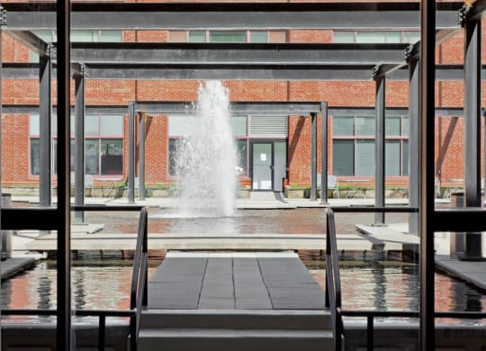a large fountain in the middle of a building at Tindeco Wharf, Baltimore, MD