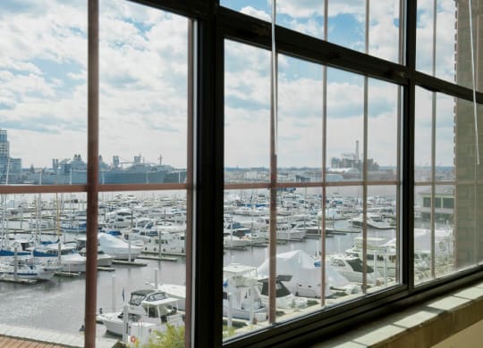a window view of a marina filled with boats at Tindeco Wharf, Baltimore, MD 21224