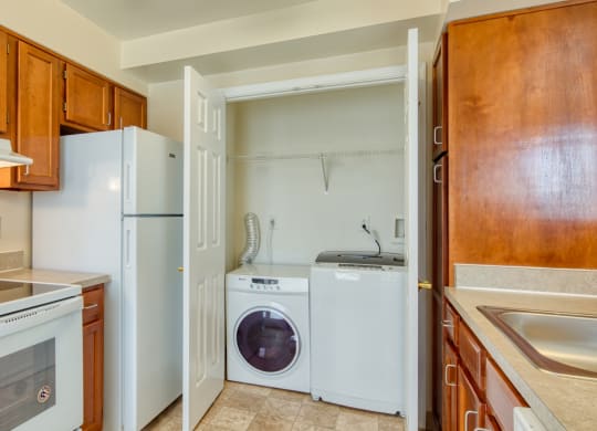 a kitchen with a washer and dryer and a door to the laundry room at North Market South Carroll, Frederick, 21701