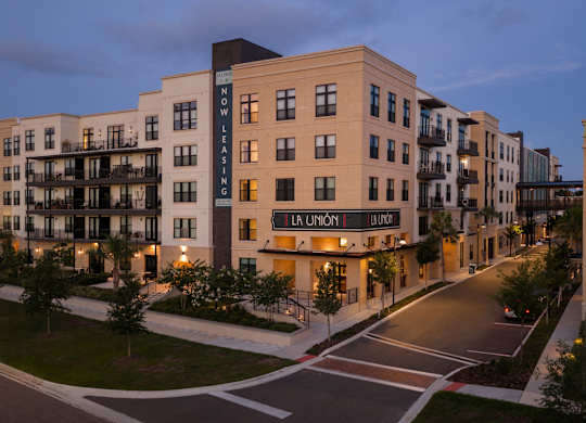 A building with the words "Now Leasing" on it.