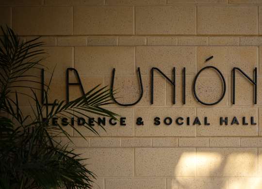 A sign that says La Union on a wall.