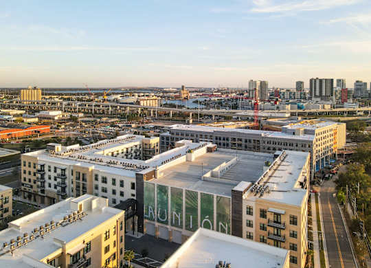 A cityscape with buildings and a clear sky.
