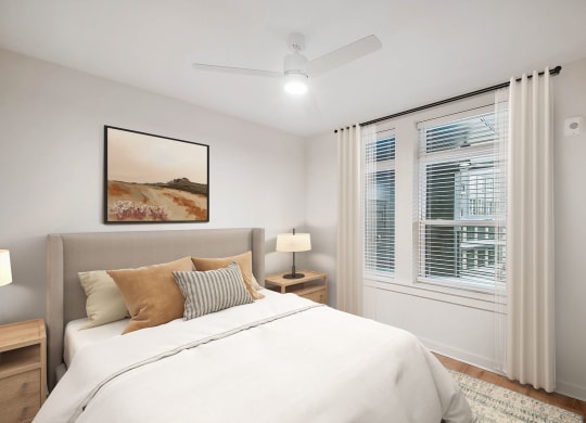 a bedroom with a large bed and a window at Hawkins Press Apartments, Charlotte