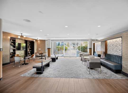 A modern living room with a large window and a view of the city.
