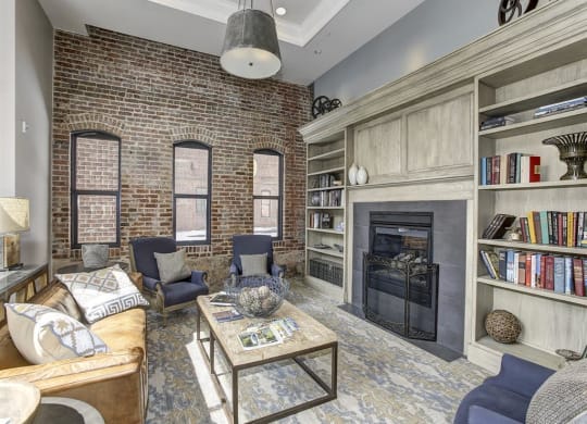 a living room with a brick wall at The Gunther, Baltimore, 21224