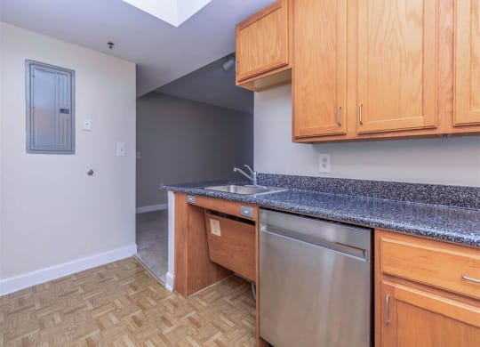 a kitchen with a sink and a dishwasher at The Gramax, Silver Spring, MD, 20910
