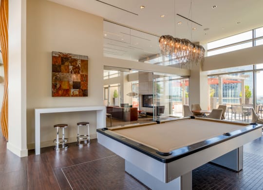a game room with a pool table and a bar at The Acadia at Metropolitan Park, Virginia, 22202