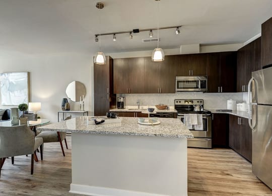 Kitchen and dining area in a unit at Highgate At The Mile in McLean, Virginia