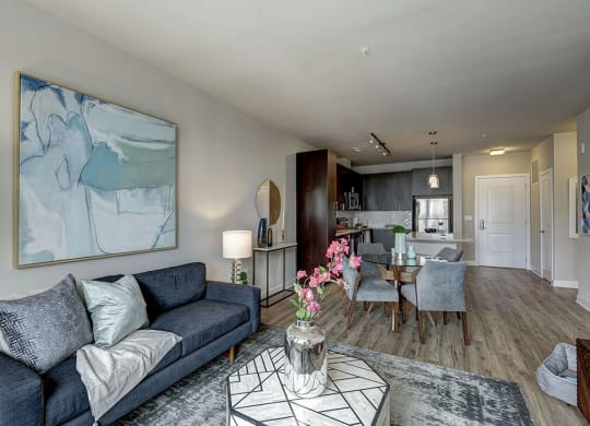 Spacious Living room with a couch and a coffee table at Highgate At The Mile near Tysons, VA