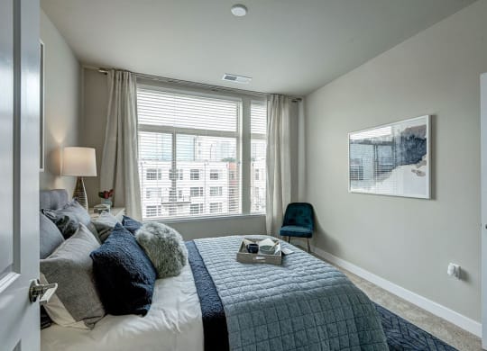 Bedroom with a large window at Highgate at the Mile, McLean Virginia