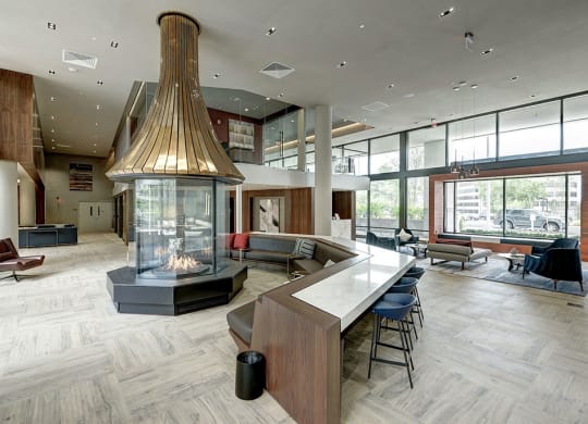 a large lobby with a fireplace at Highgate At The Mile Apartments in McLean, Virginia