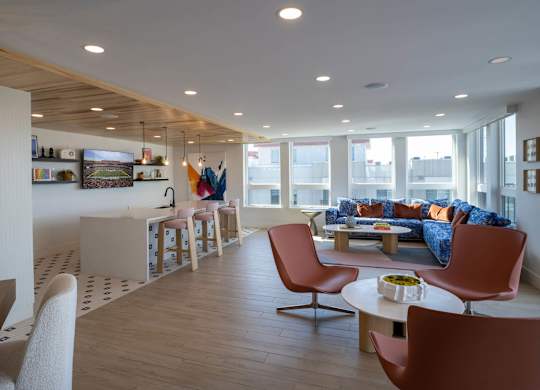 A living room with a white couch and a coffee table at Jayde Parkside Apartments, Washington