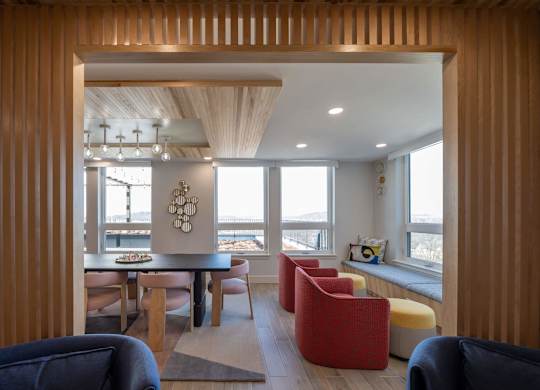A modern living room with a dining table and chairs at Jayde Parkside Apartments, Washington, DC