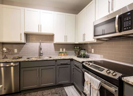 A Kitchen With a Oven at The Aster Cary, Cary, 27519