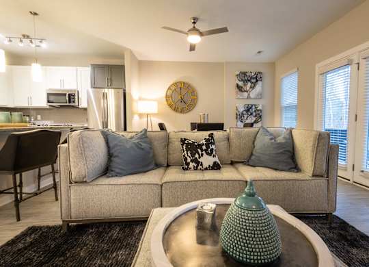 A Living Room With a Green Lamp at The Aster Cary, Cary North Carolina